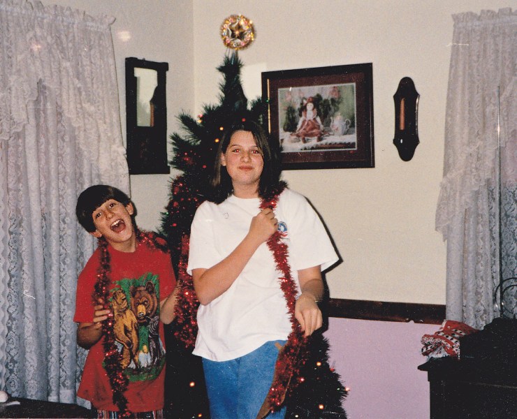 1992?  93?  This is our  approximate age when we made our combined drawings.  It's quite interesting to note that this is THE pose Brother and I strike for most of our photographs.  Travis with his head thrown back with a joyful laugh, me looking straight ahead with serious smile.